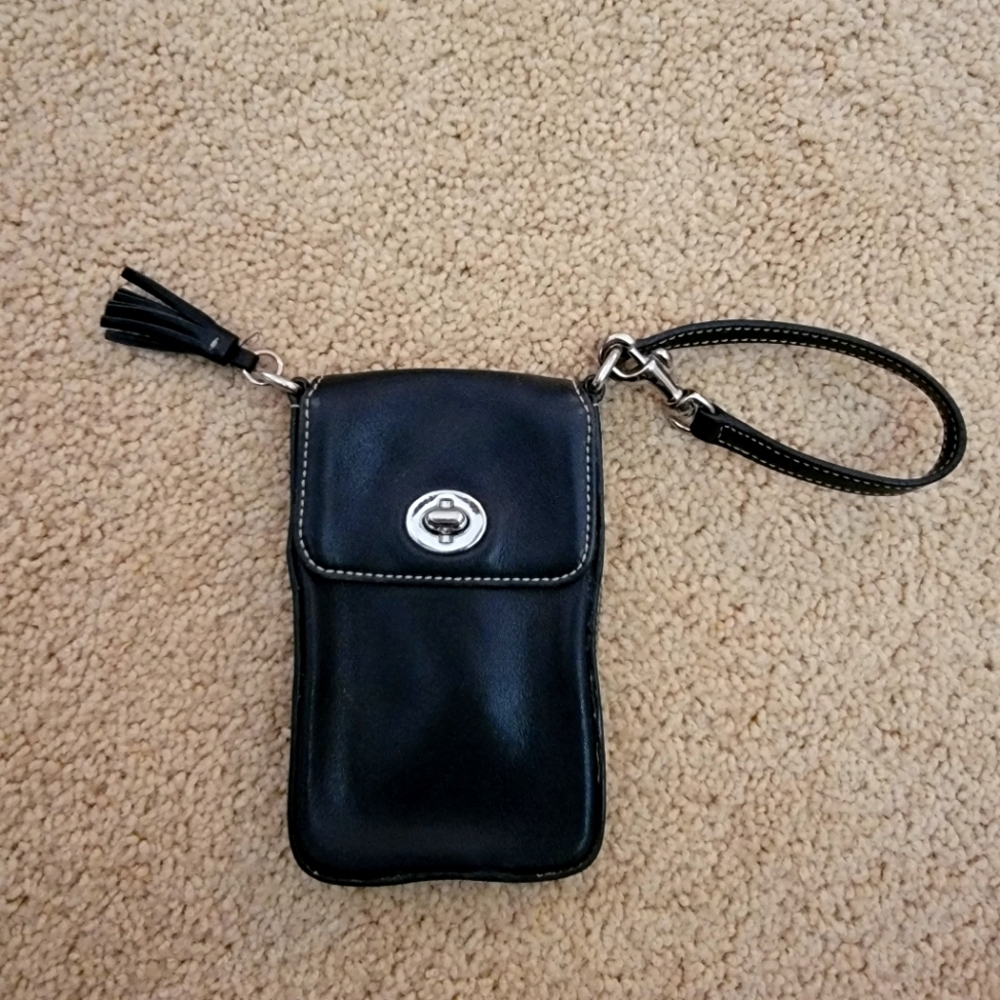 COACH Vintage leather phone wristlet.